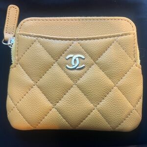 Brand new Chanel yellow coin purse with tags, duster bag and original box
